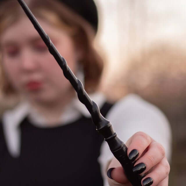 Customer review photo of a woman holding her custom fantasy wand.